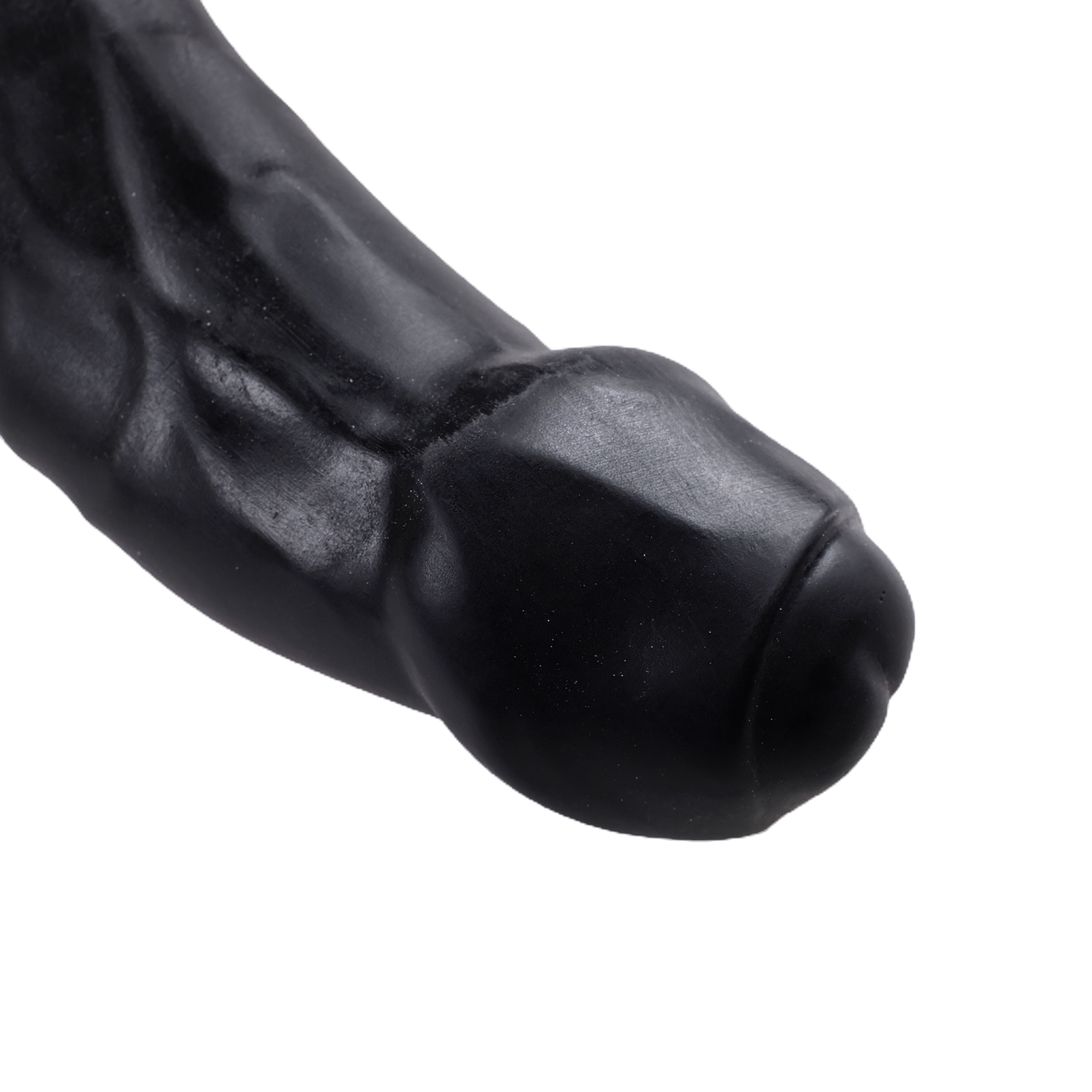 Close-up of the head, on Black. Foreskin is partially retracted, revealing the tip.