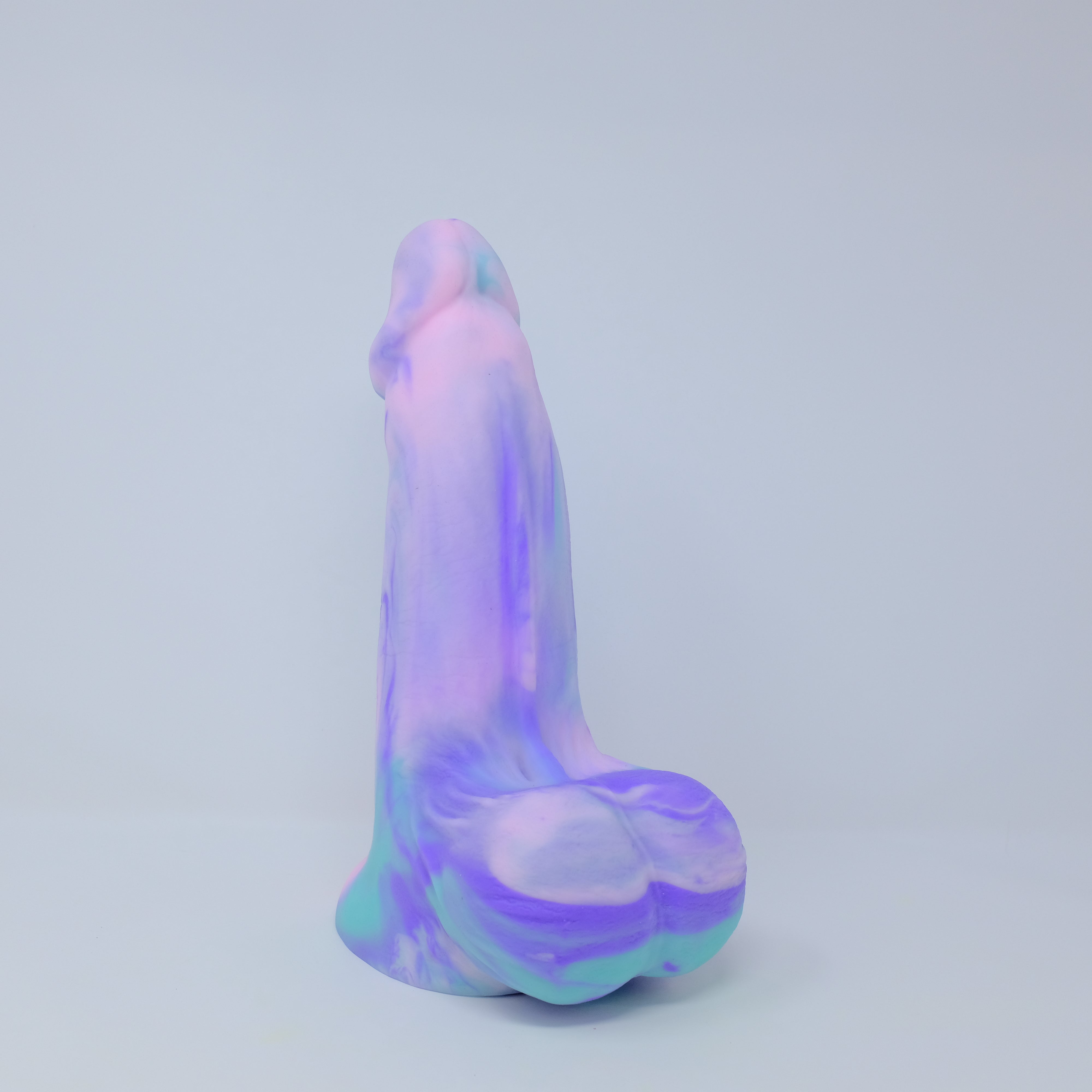 45 degree angle view of Posh Boy in size Large, Kinglor (a pink, purple and teal fusion).